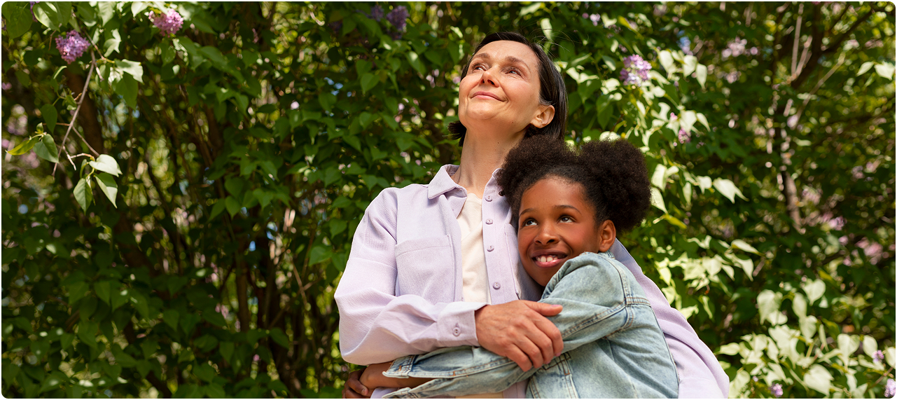 A family supported by Tchanmeni Health Services — outdoors, happy
